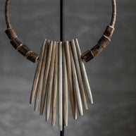 Decorative wooden necklace on an stand