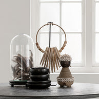 Decorative wooden necklace on an stand