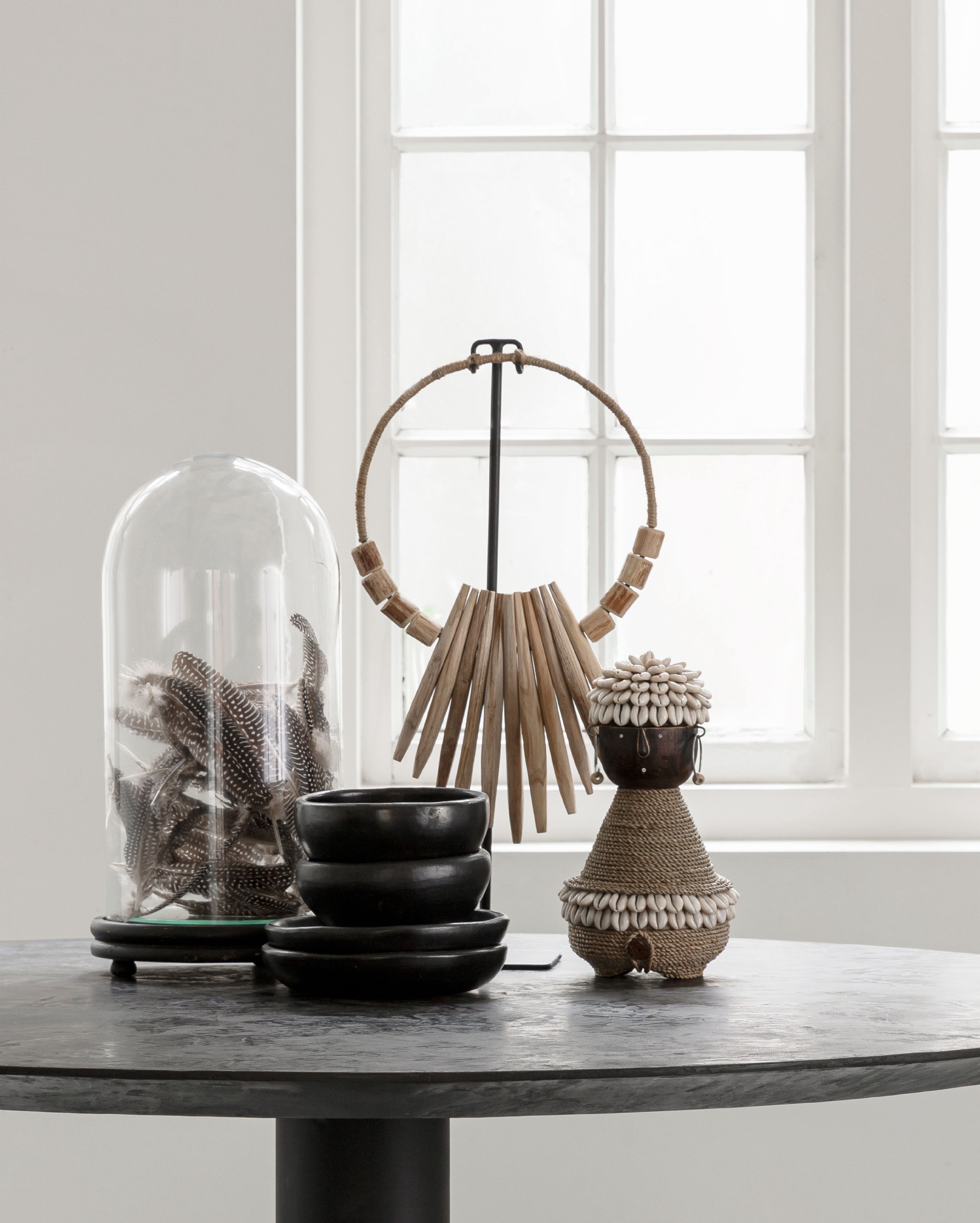 Decorative wooden necklace on an stand